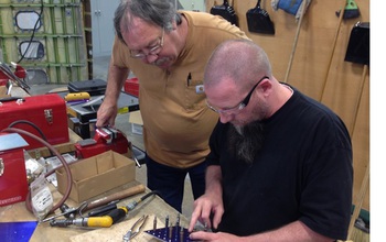 Instructor working with a student at a technology center